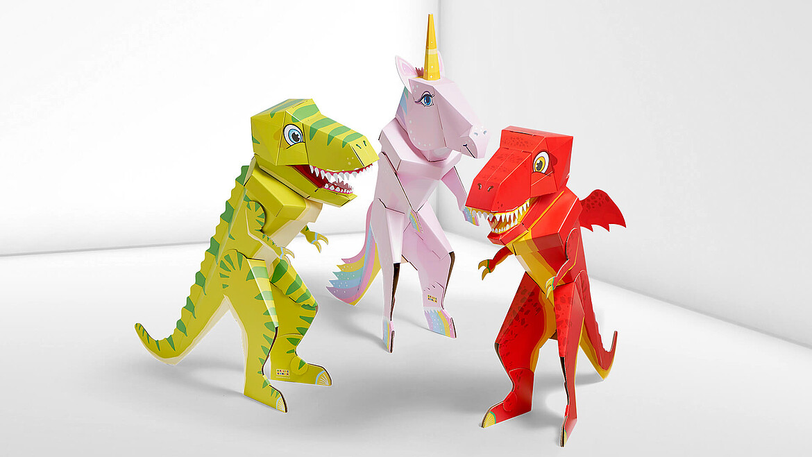 Schultüten in Form von Dinosaurier, Drache und Einhorn